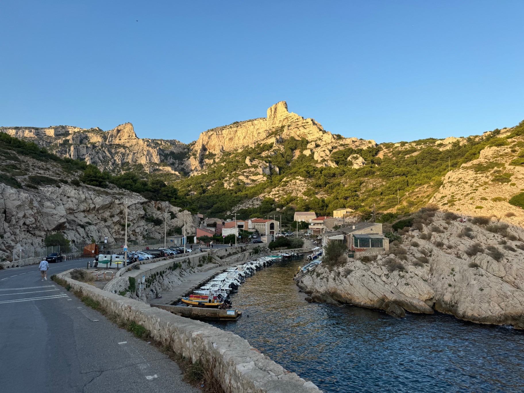 Callelongue fishing port and Calanques National Park cliffs at golden hour, Marseille